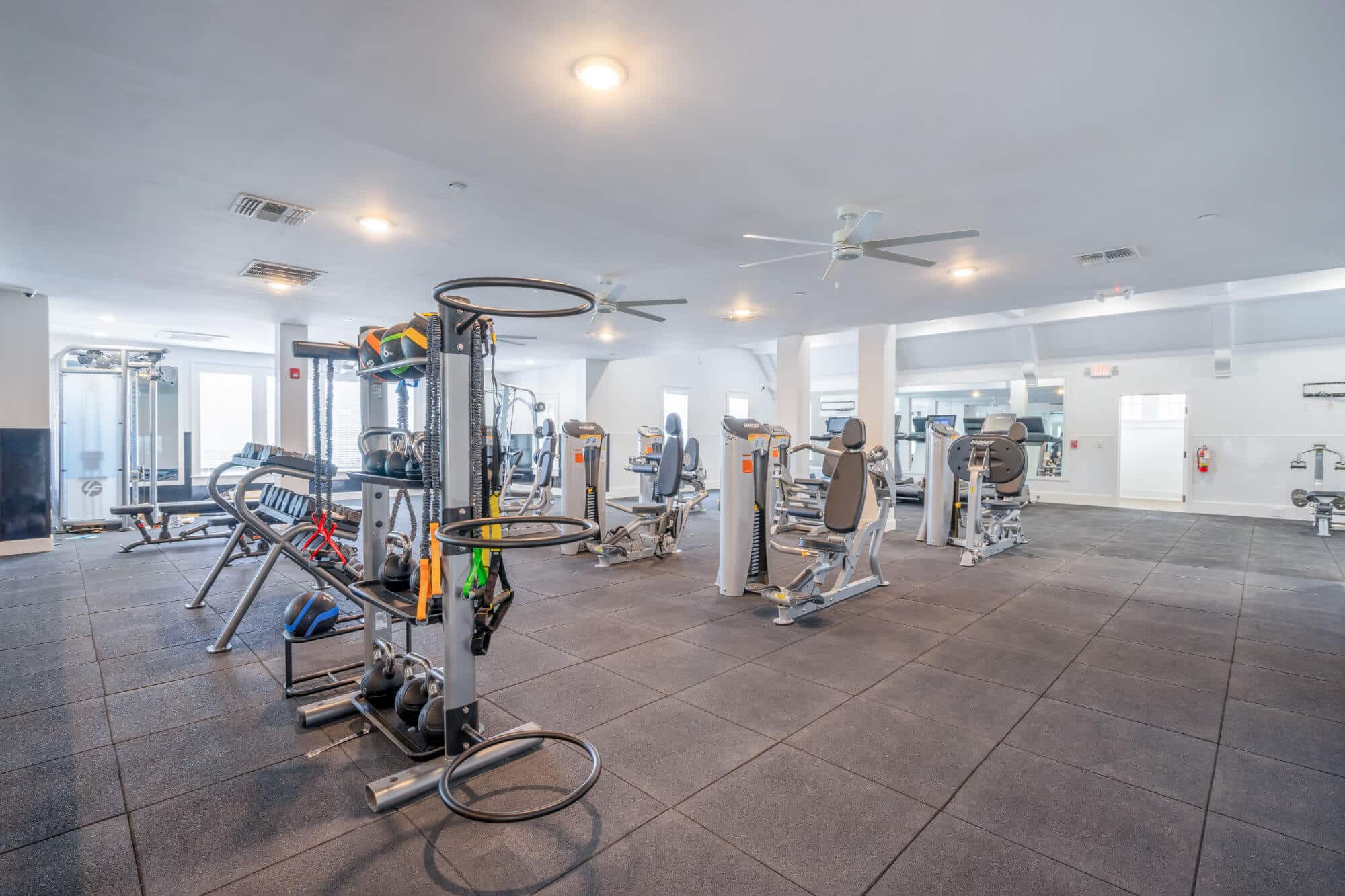 the collective at lubbock off campus cottage apartments near texas tech ttu community amenities fitness center weights and machines